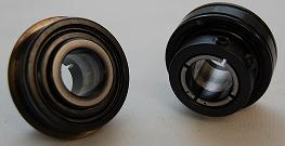 Two mechanical seals on a white surface.